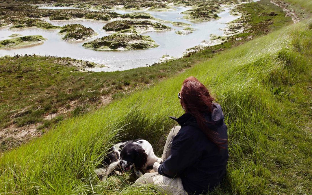 A person taking a mindful breath, grounding themselves in the present moment